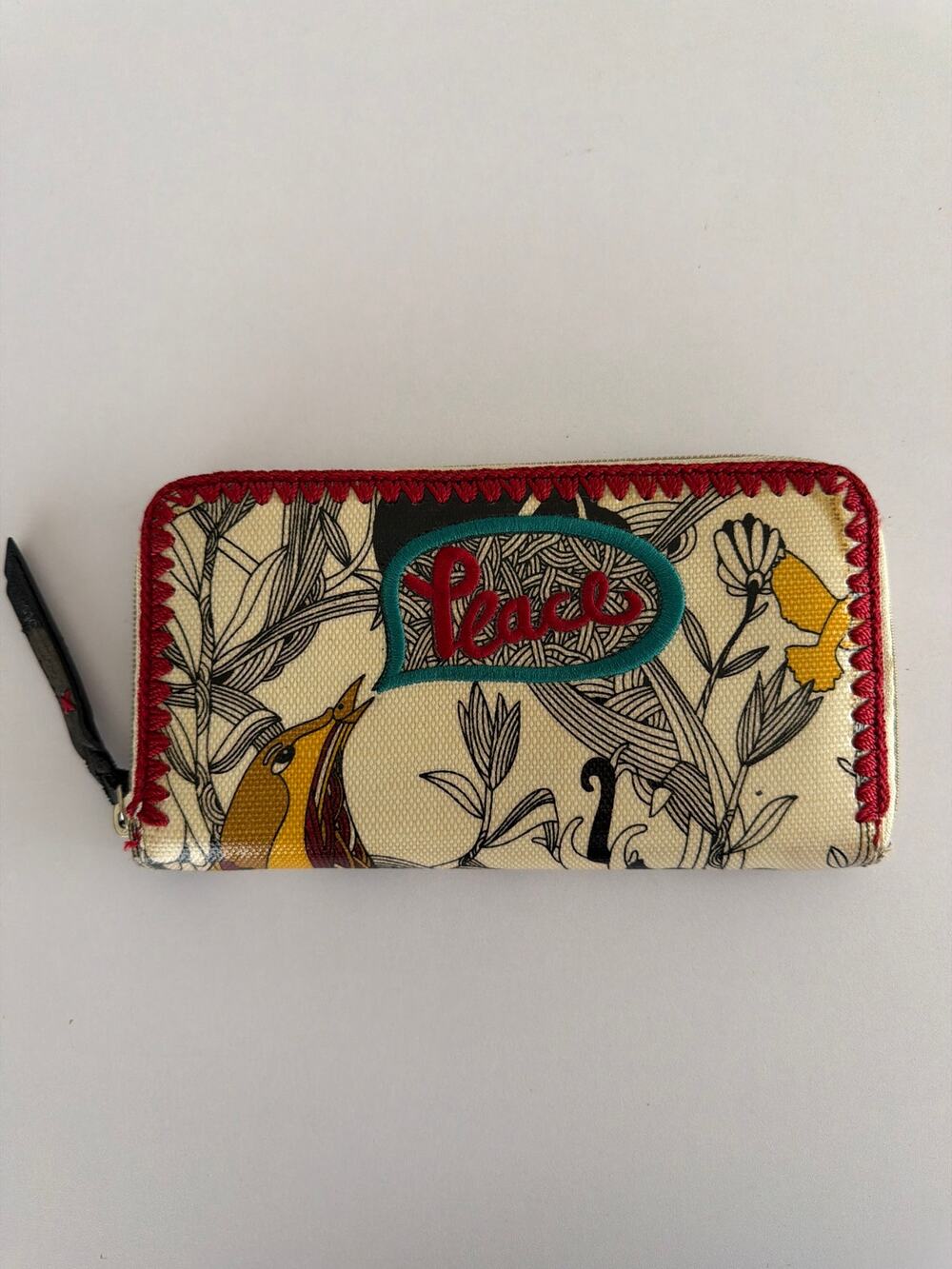 The Sak Sakroots Peace Coated Canvas Zip Around Wallet Floral Boho Embroidered